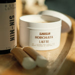 The Sundream and SIN-MIN Gift Set with lip balms, horchata latte candle, and body lotion.