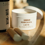 The Sundream and SIN-MIN Gift Set with lip balms, horchata latte candle, and body lotion.