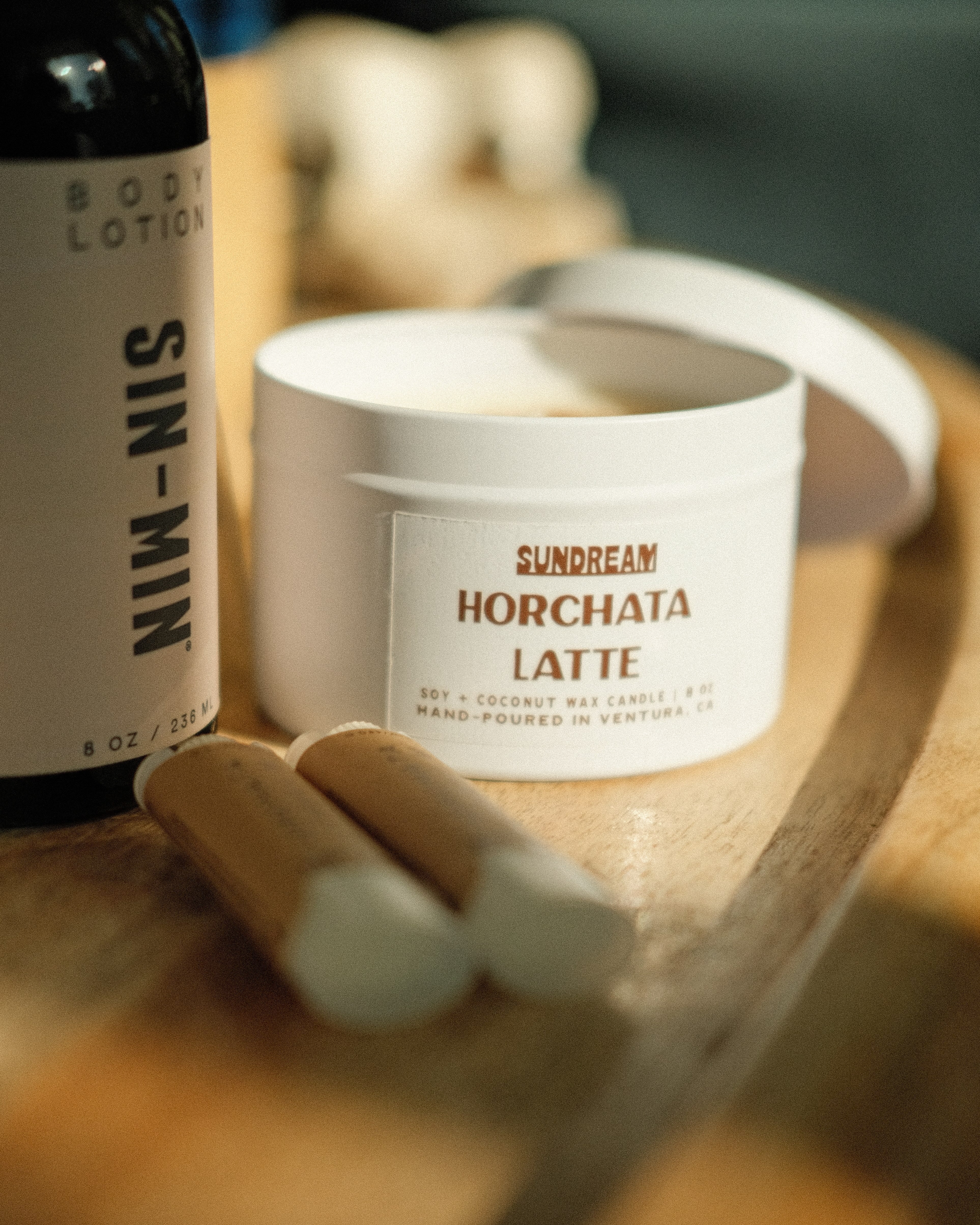The Sundream and SIN-MIN Gift Set with lip balms, horchata latte candle, and body lotion.