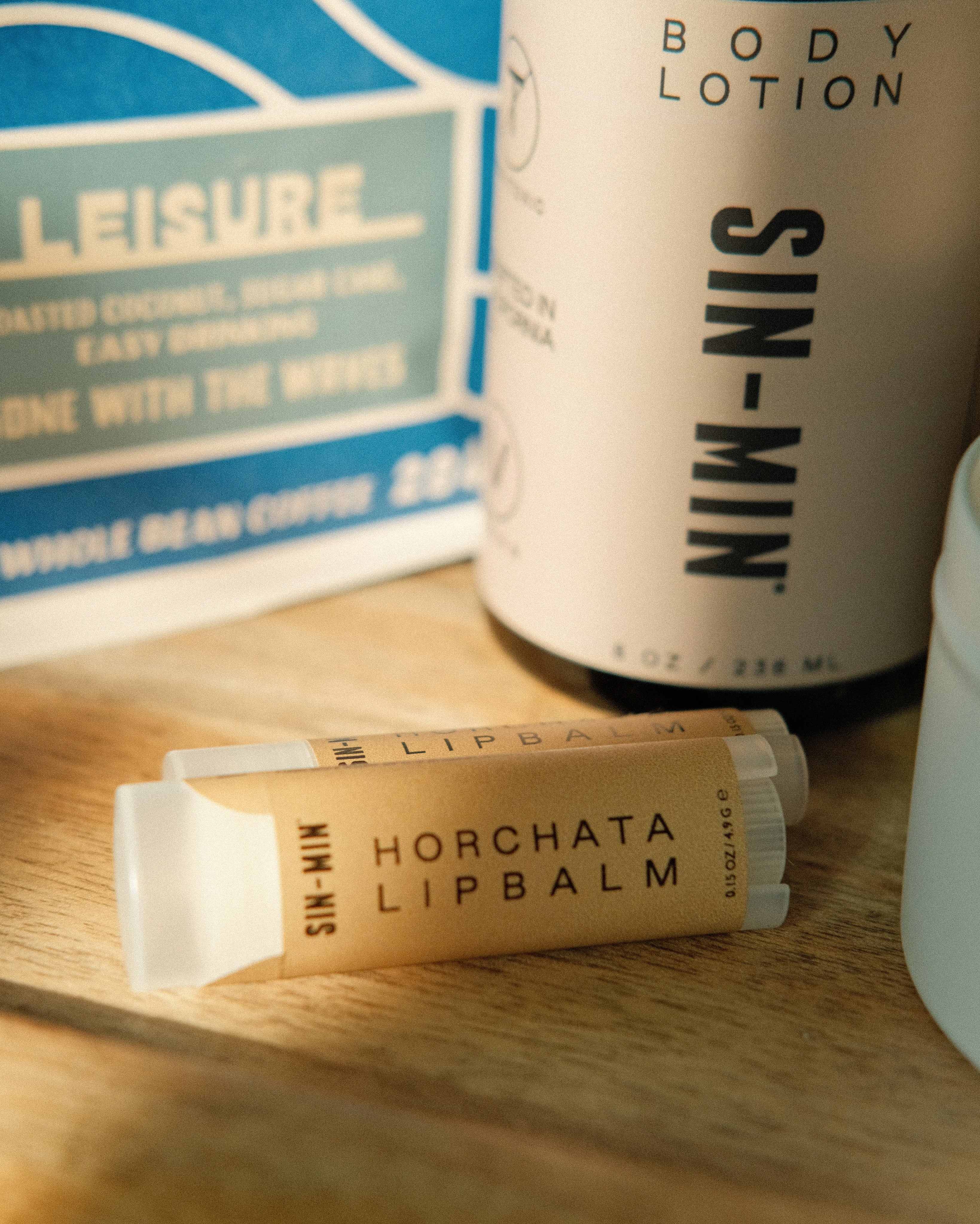 The Sundream and SIN-MIN Gift Set with lip balms, body lotion, and coffee.