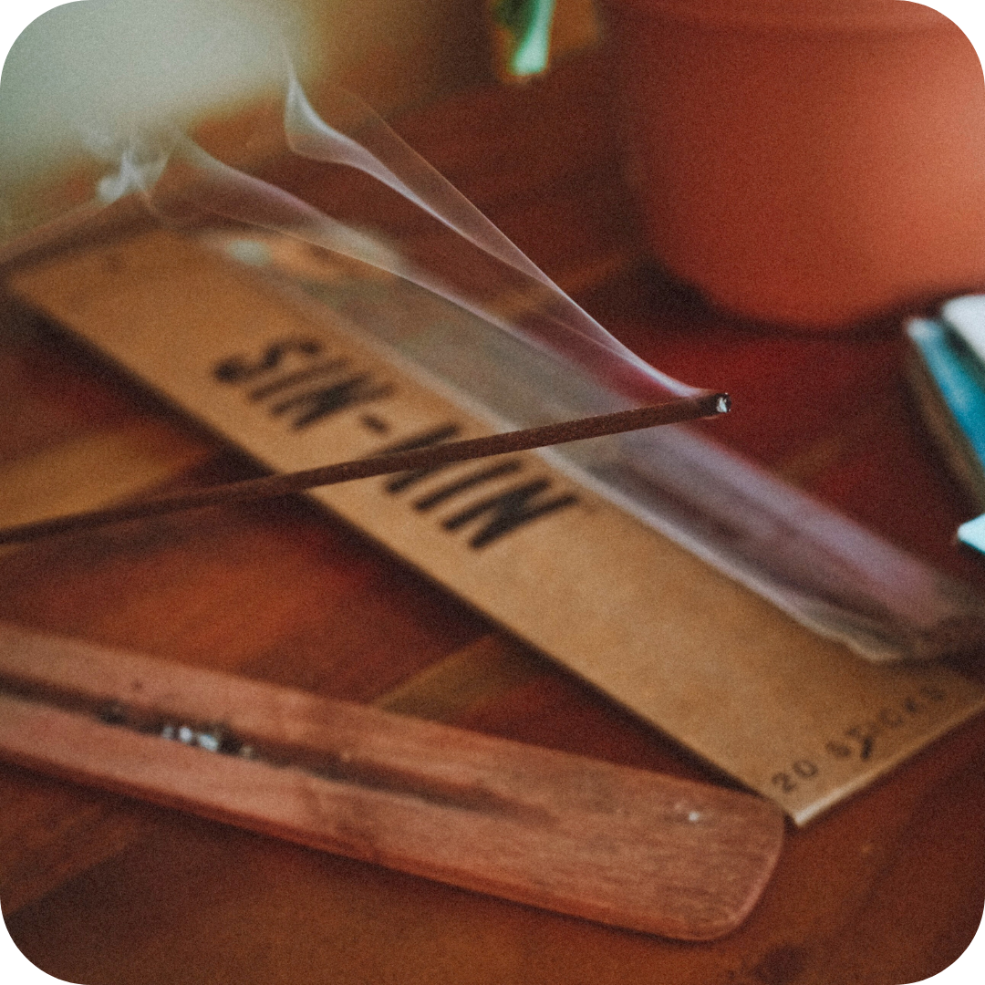Incense burning with a pack of SIN-MIN Cinsense in the background