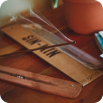 Incense burning with a pack of SIN-MIN Cinsense in the background