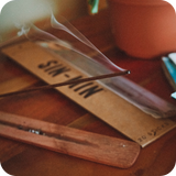 Incense burning with a pack of SIN-MIN Cinsense in the background