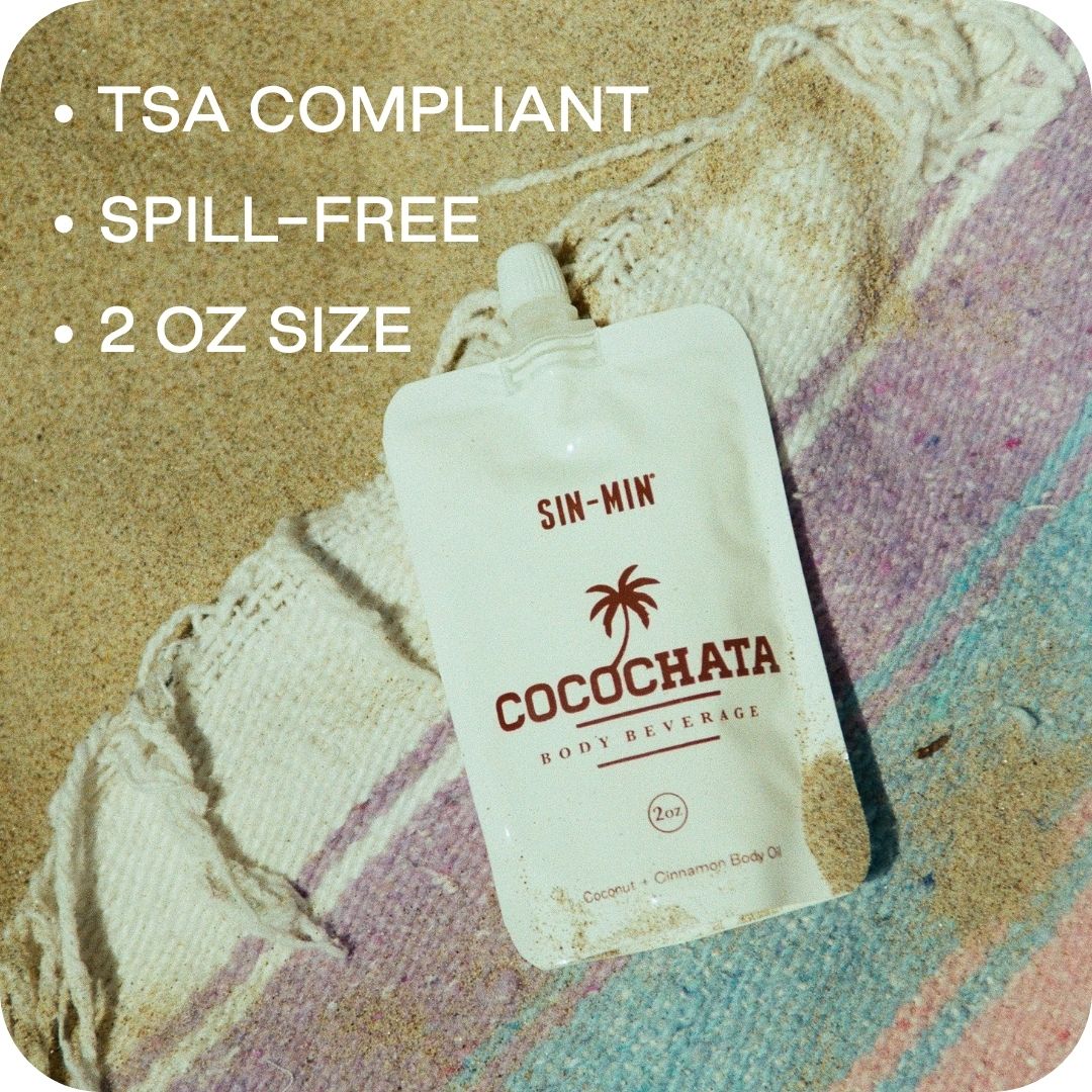 Picture of cocochata body beverage on the beach with the words tsa compliant, spill-free, and 2 oz size
