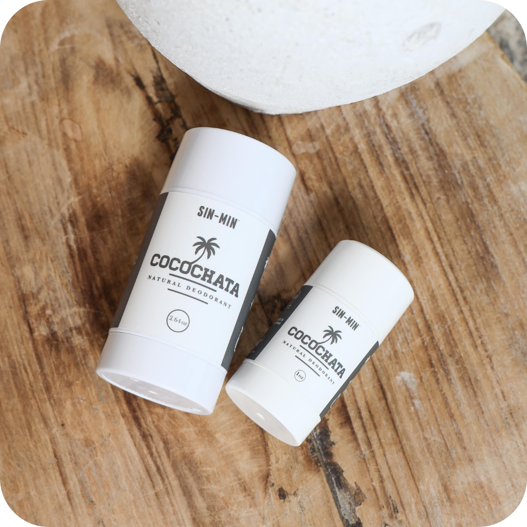 both sizes of Cocochata deodorant on a wood table
