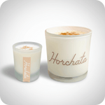 3 oz and 10 oz horchata candles with a light grey background