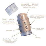 Image of cinnamon deodorant with the cap removed that states the aspects of the deodorant: balanced baking soda formula for sensitive skin, zinc oxide helps endure through workouts and long days without reapplying, zero emulsifiers or stabilizers or preservatives or binders, vegan, one hundred percent all natural, unisex, made with ceylon cinnamon oil to combat body odor causing bacteria